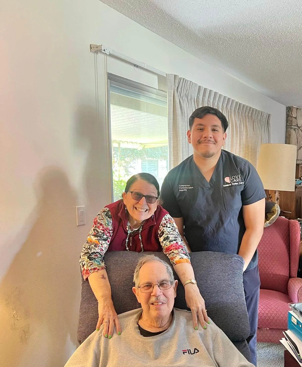 Love and Care Staff with elder couple
