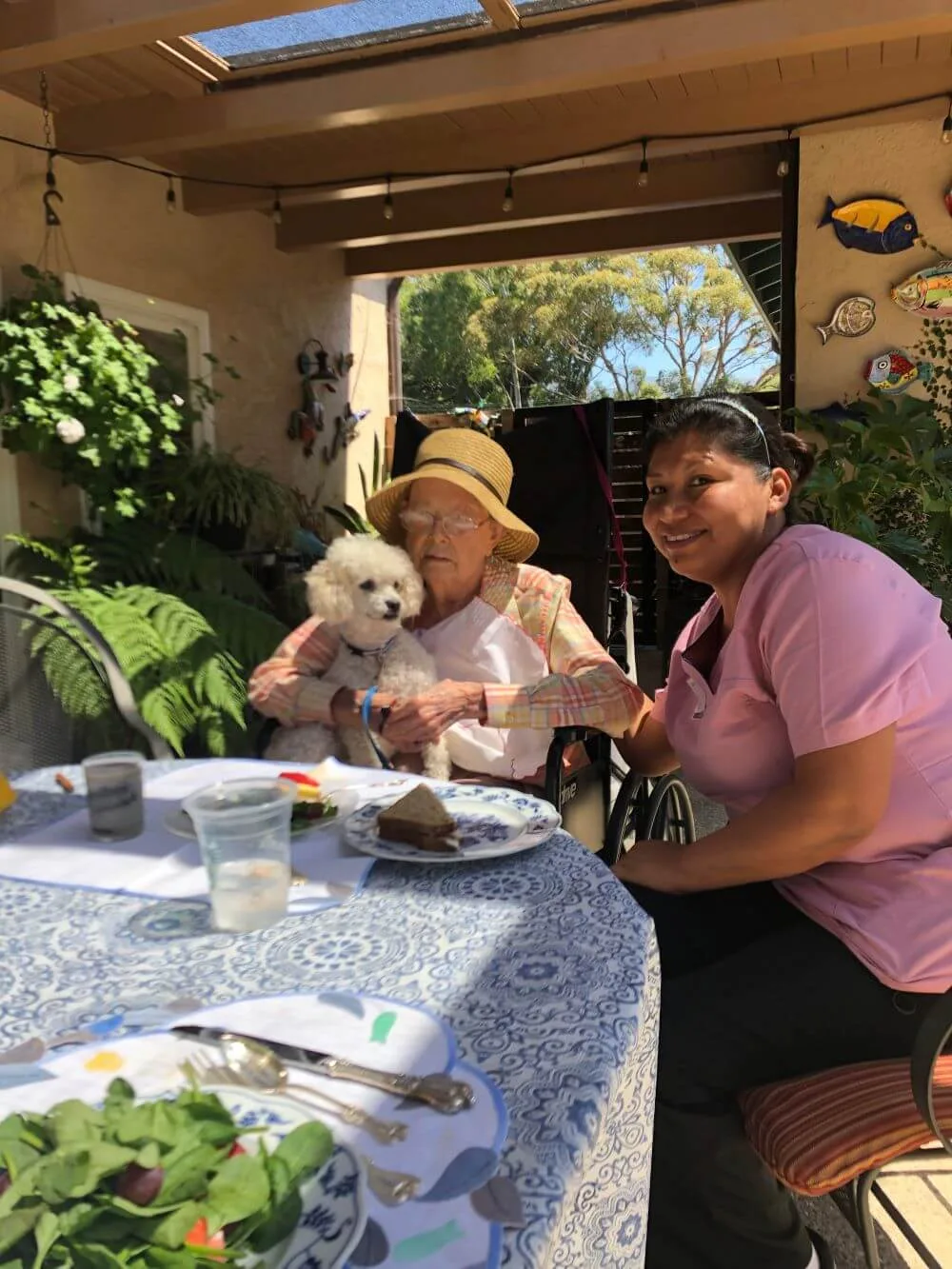 Our Staff eating with the elder woman